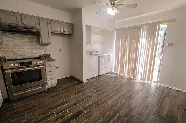 a kitchen with a stove and a microwave