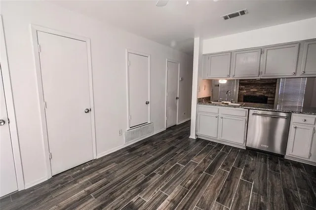 a view of a kitchen with electric appliances