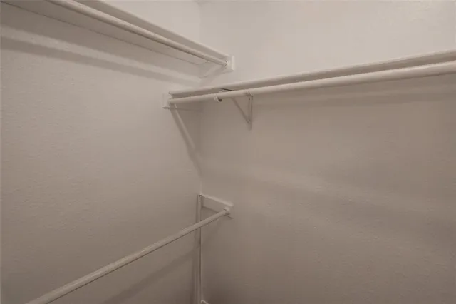 a view of a room with shelf on the wall