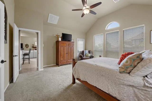 a bed room with a bed and a chandelier