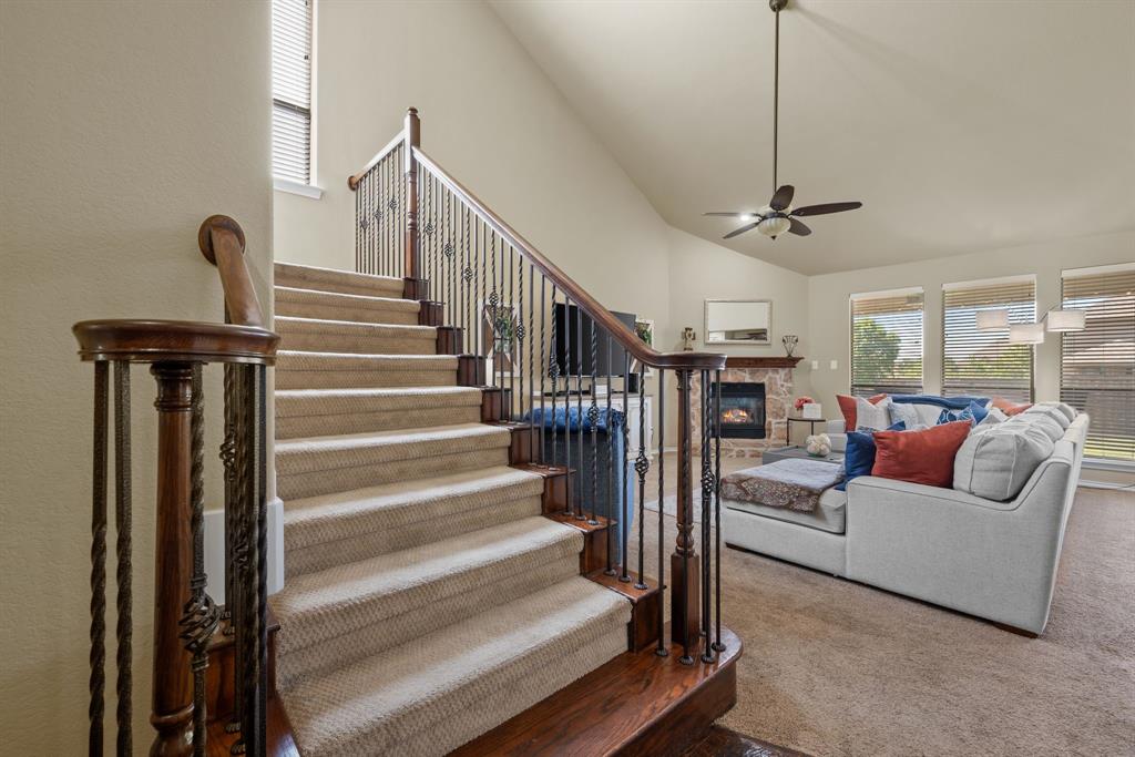 4172 Drexmore Road Fort Worth, TX 76244 - Photo 21 of 37 a living room with furniture and a chandelier