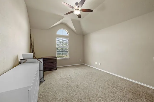 a living room with furniture a chandelier and a flat screen tv