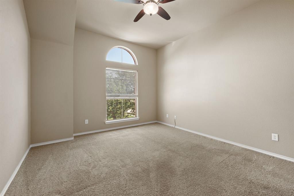 4172 Drexmore Road Fort Worth, TX 76244 - Photo 27 of 37 an empty room with windows and fan
