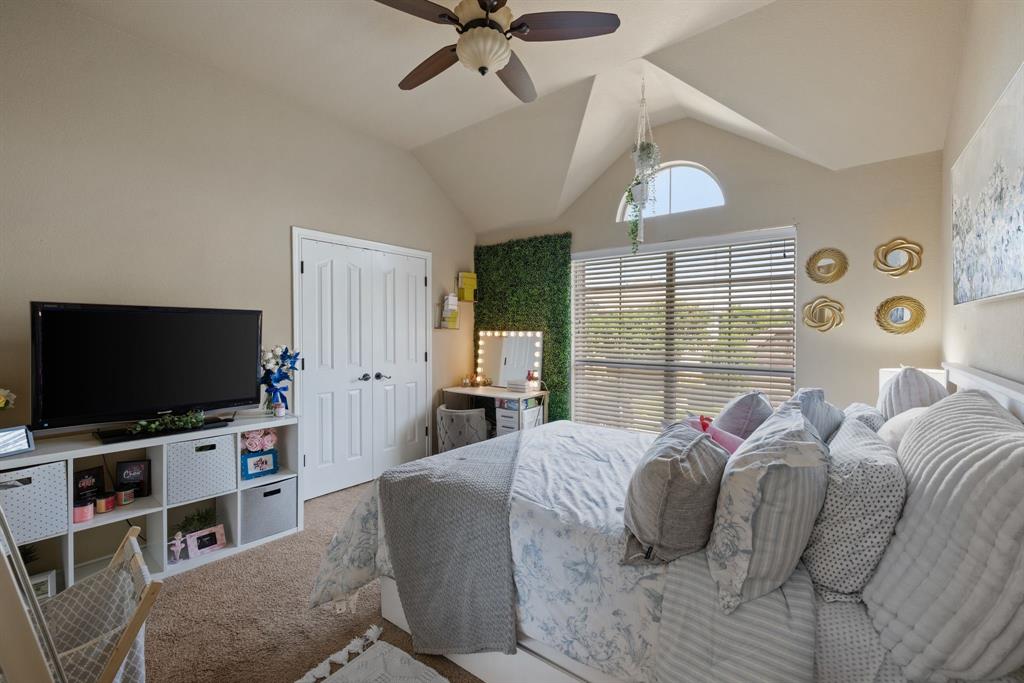 4172 Drexmore Road Fort Worth, TX 76244 - Photo 28 of 37 a bedroom with a bed and a flat screen tv