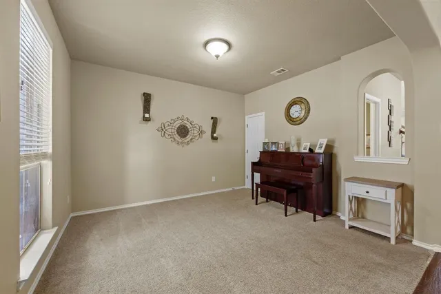 a room with furniture and a mirror