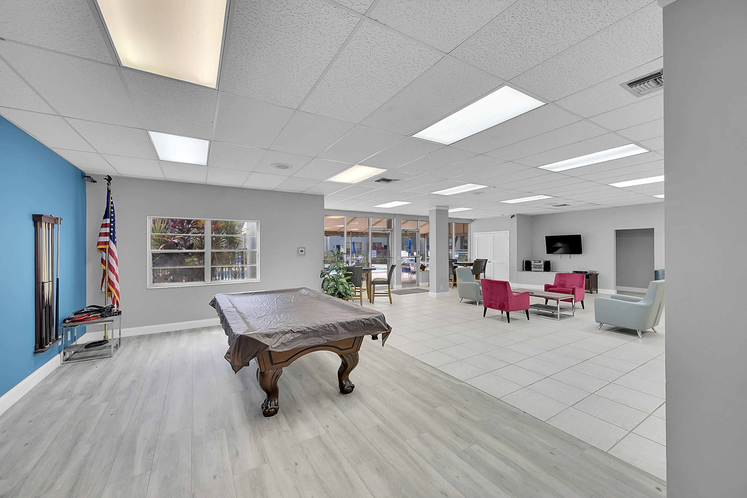 2920 Southwest 22nd Avenue, Unit 6040 Delray Beach, FL 33445 - Photo 26 of 53 a room with furniture and a wooden floor