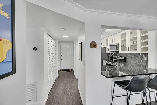 a kitchen with stainless steel appliances granite countertop a sink and cabinets