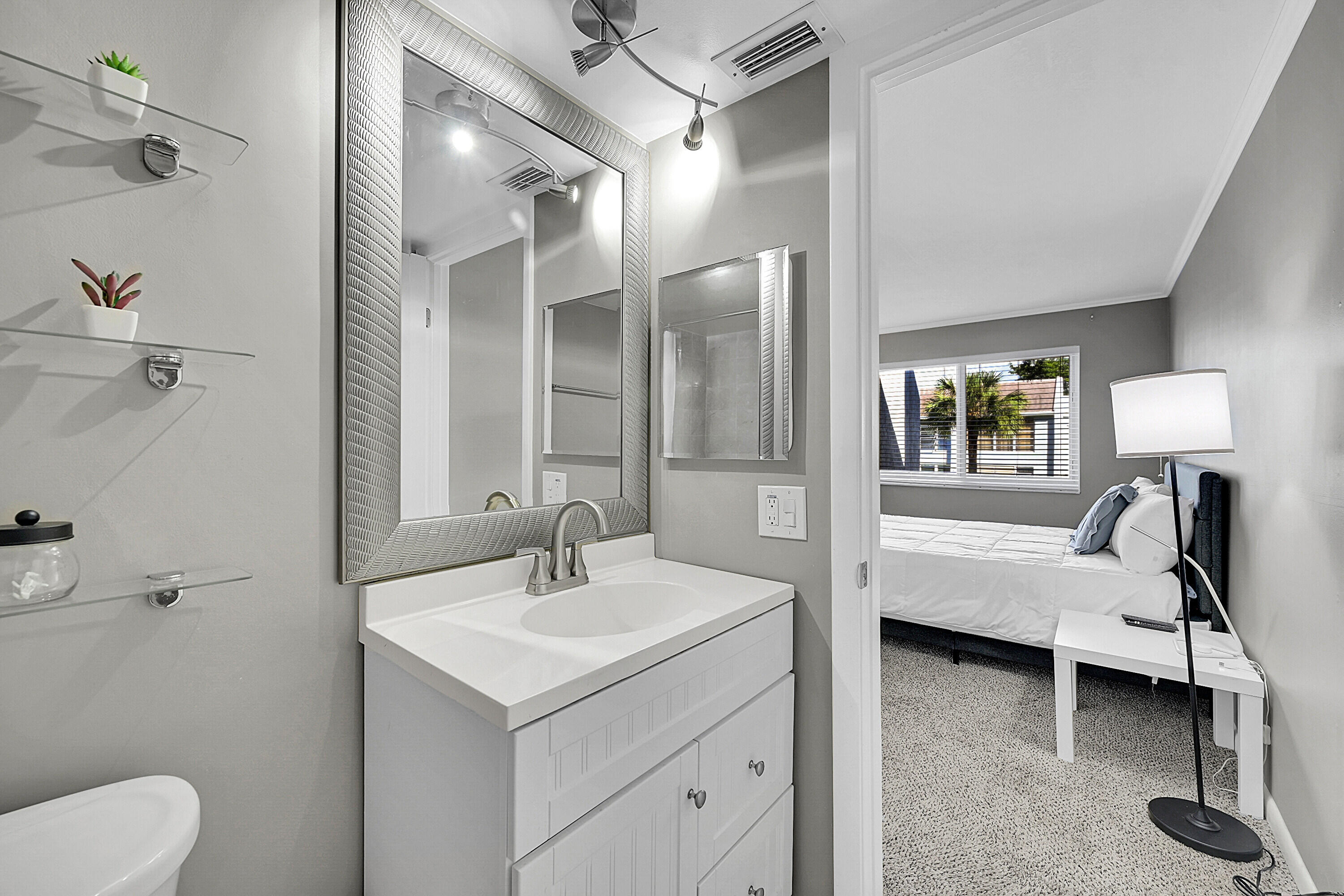 2920 Southwest 22nd Avenue, Unit 6040 Delray Beach, FL 33445 - Photo 33 of 53 a en suite bathroom with a toilet sink and mirror