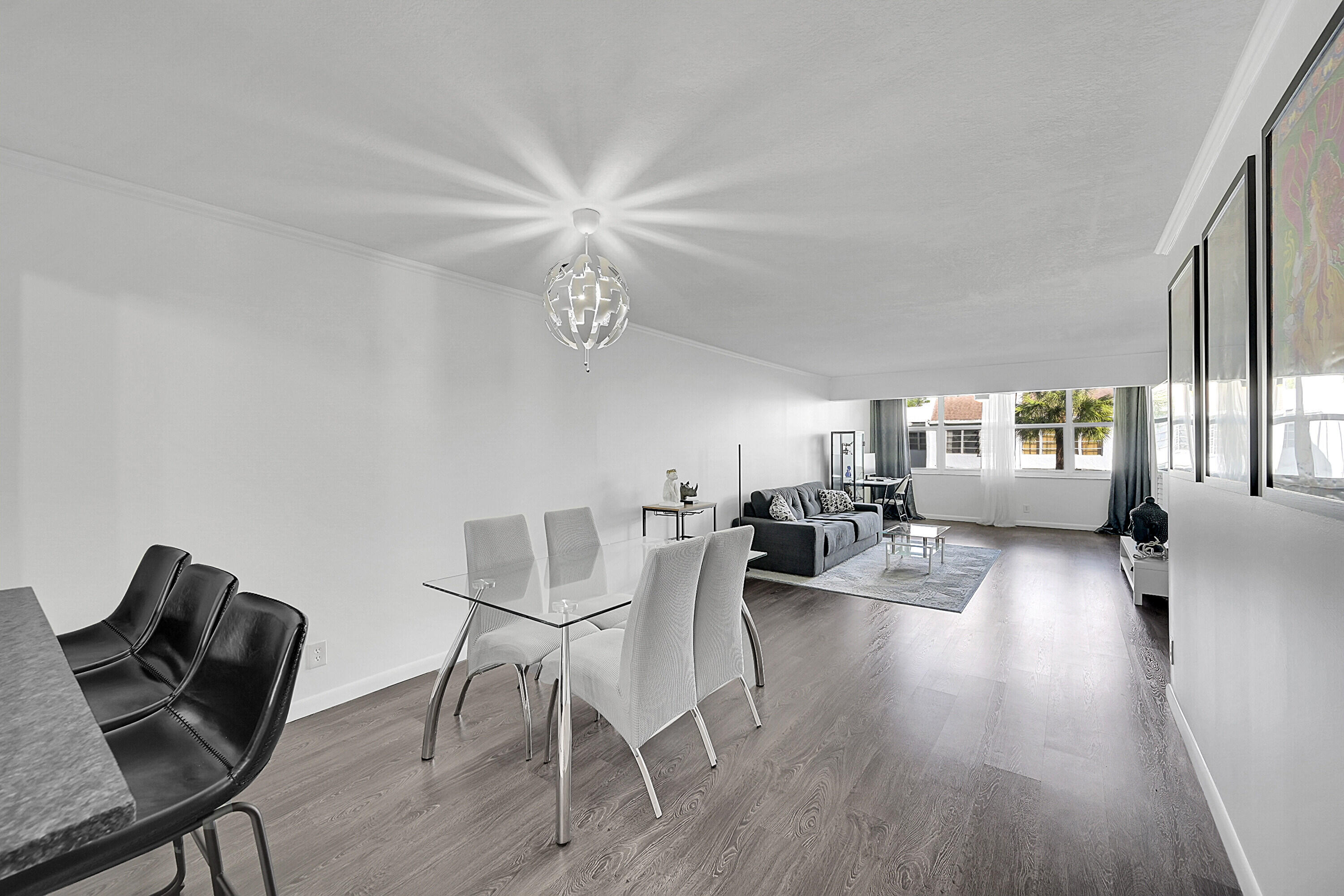 2920 Southwest 22nd Avenue, Unit 6040 Delray Beach, FL 33445 - Photo 37 of 53 a view of a dining room with furniture and wooden floor