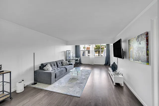 a bedroom with a bed and a night stand