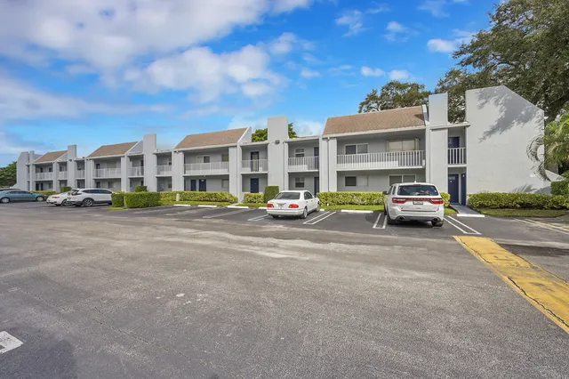 a bedroom with a bed lamp and window