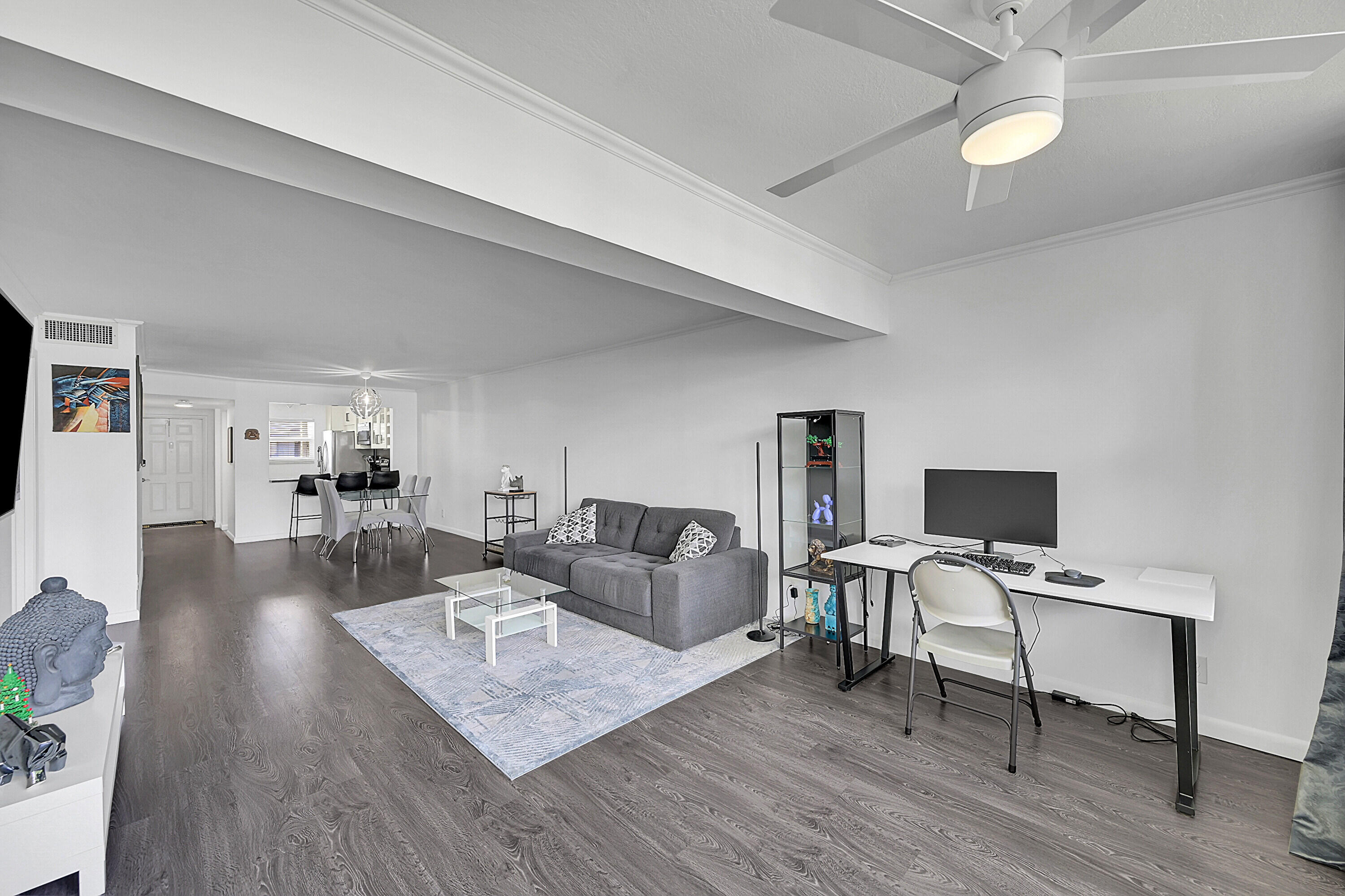 2920 Southwest 22nd Avenue, Unit 6040 Delray Beach, FL 33445 - Photo 53 of 53 a living room with furniture and a wooden floor