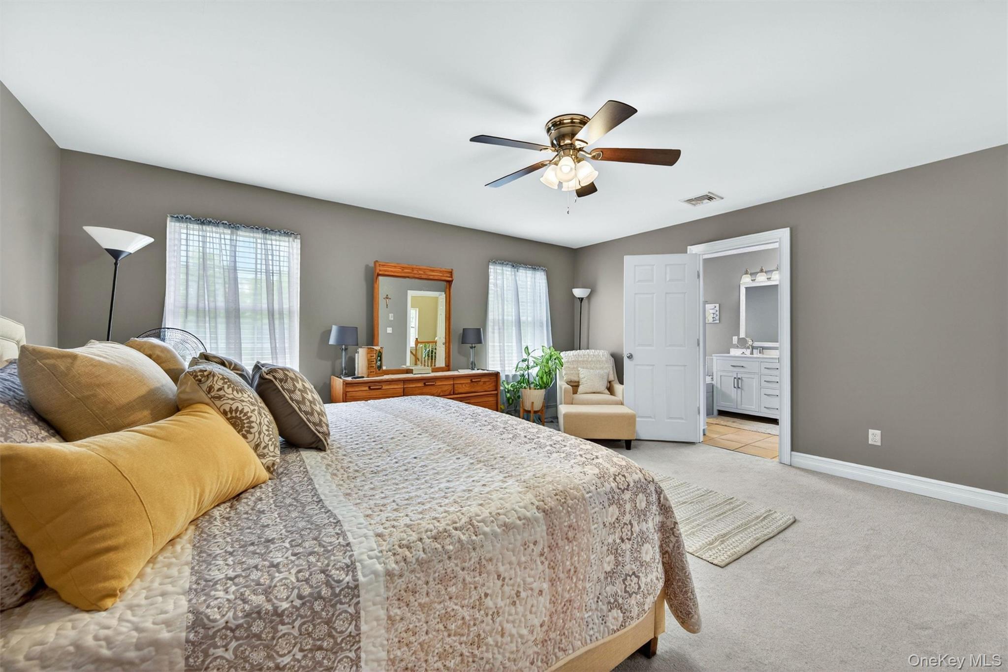 19 Pirog Road Pine Bush, NY 12566 - Photo 22 of 50 a bedroom with a large bed and a chandelier