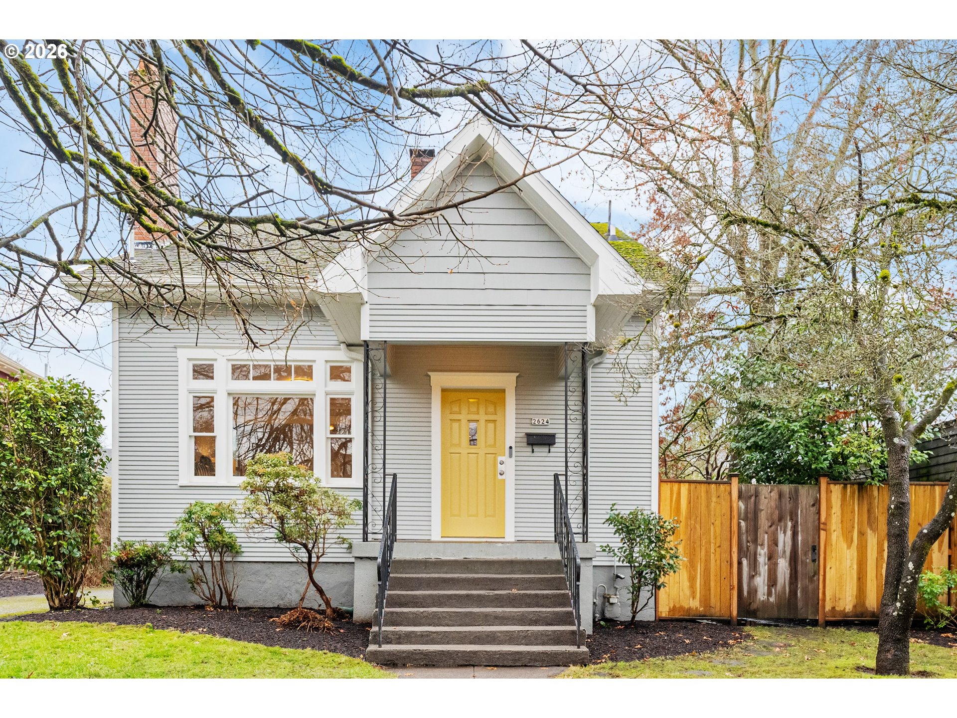 2624 Southeast Kelly Street Portland, OR 97202 - Photo 1 of 36 a front view of a house with garden