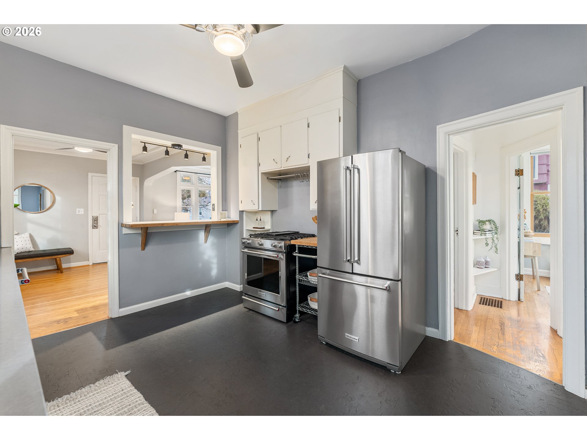 2624 Southeast Kelly Street Portland, OR 97202 - Photo 11 of 36 a kitchen with stainless steel appliances wooden floor and a refrigerator