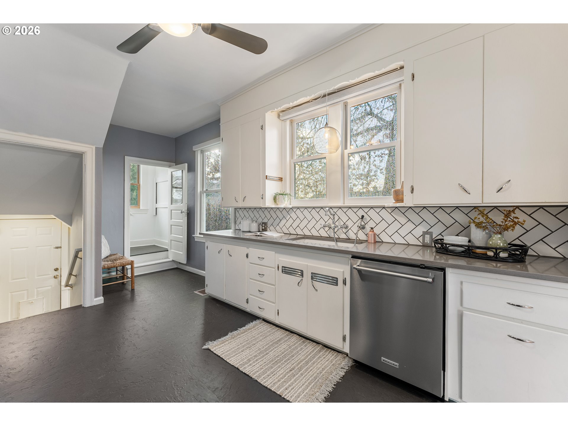 2624 Southeast Kelly Street Portland, OR 97202 - Photo 12 of 36 a kitchen with granite countertop a sink stainless steel appliances and cabinets