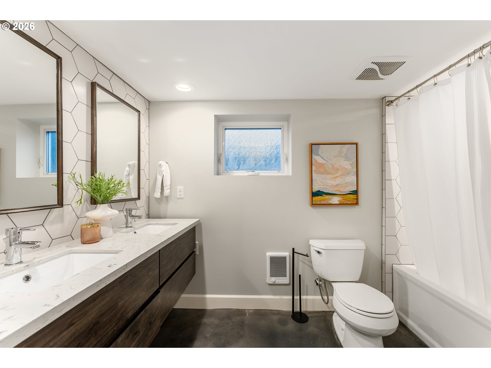 2624 Southeast Kelly Street Portland, OR 97202 - Photo 24 of 36 a bathroom with a toilet sink and mirror