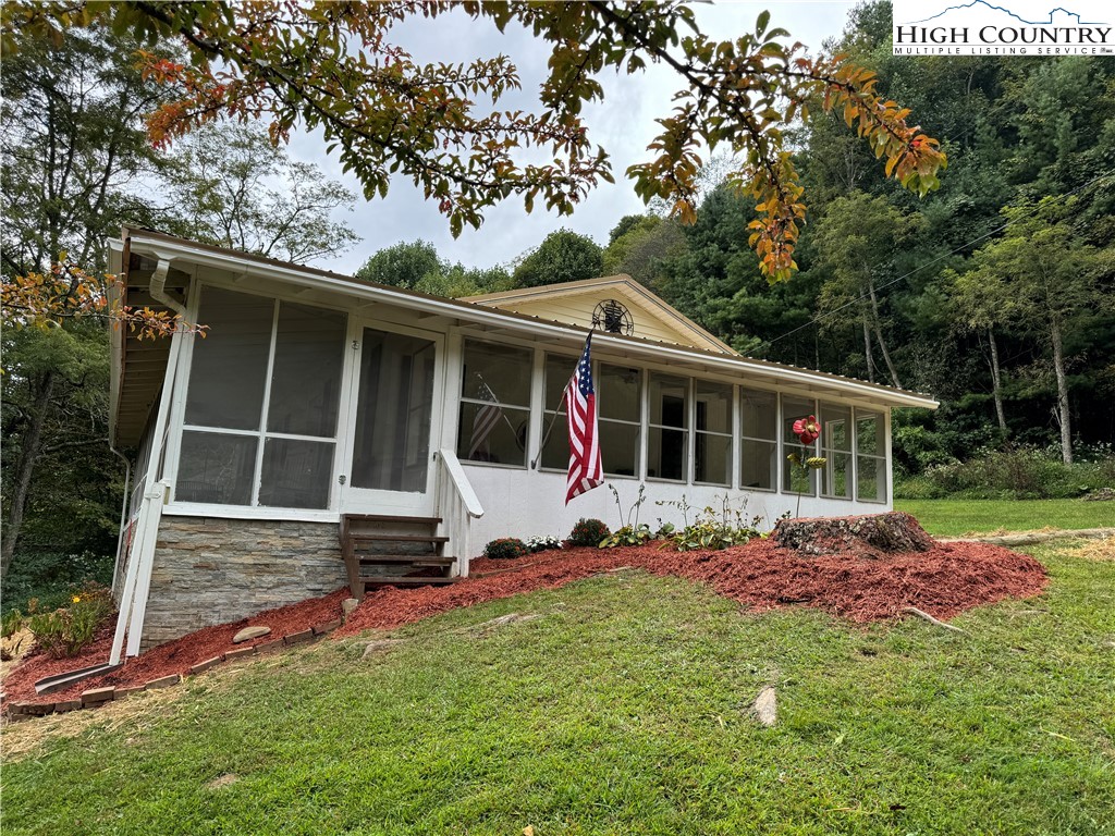 321 Skin Camp Creek Road Todd, NC 28684 - Photo 21 of 29 a view of house with backyard