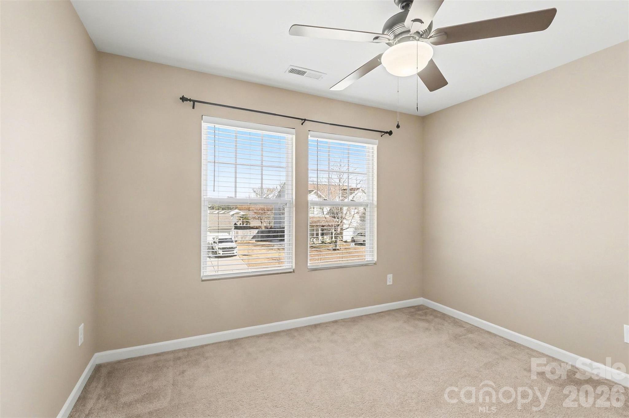 1806 Tradd Avenue Clover, SC 29710 - Photo 22 of 29 an empty room with a window and a fan
