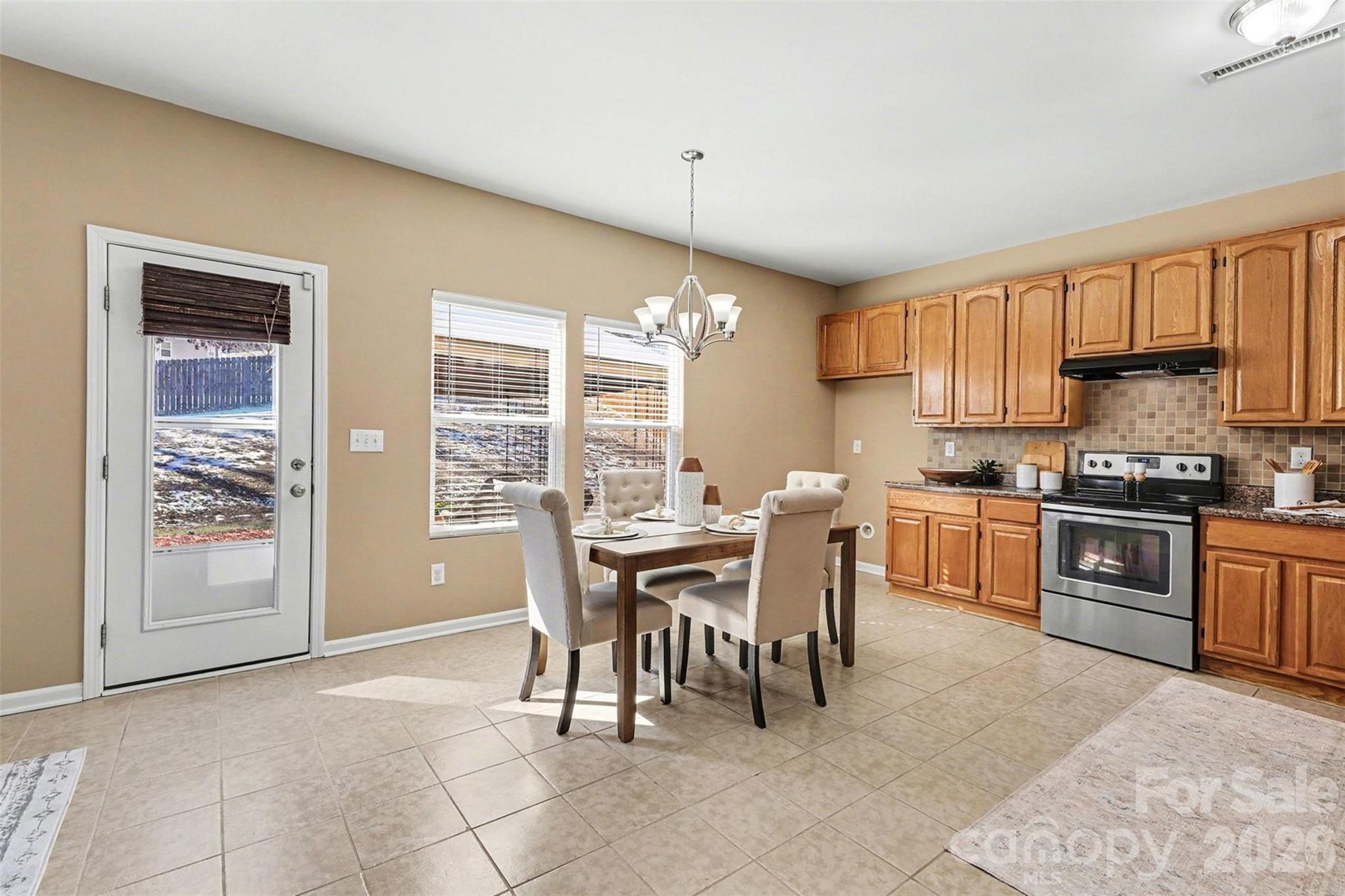 1806 Tradd Avenue Clover, SC 29710 - Photo 7 of 29 a view of a dining room with furniture window and outside view