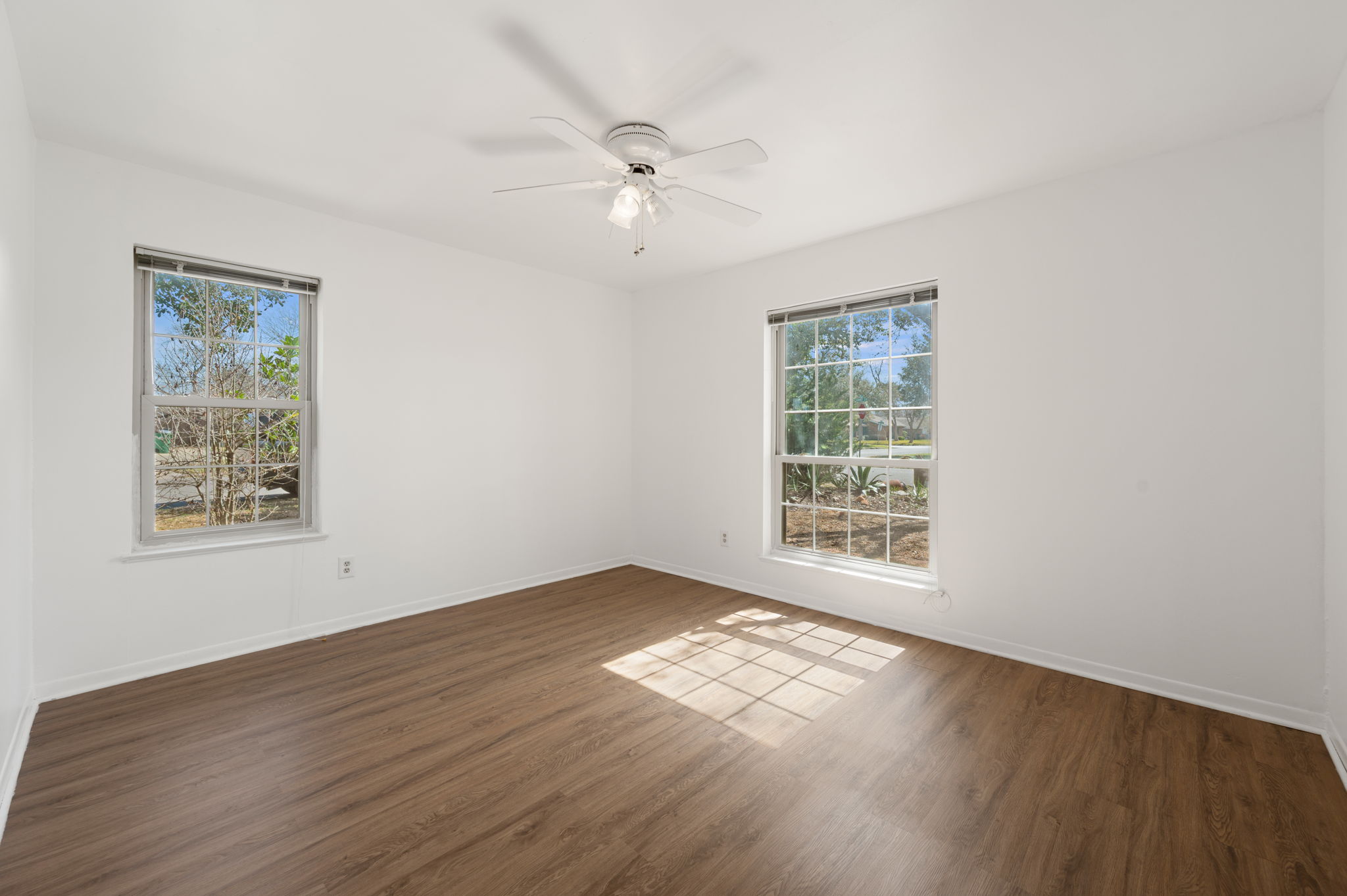 1400 Summit Circle Taylor, TX 76574 - Photo 26 of 39 a view of an empty room with wooden floor and a window