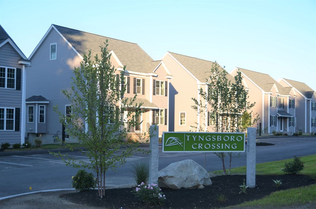 93 Riley Road, Unit 119 Tyngsborough, MA 01879 - Photo 2 of 14 a view of a street with a building in the background