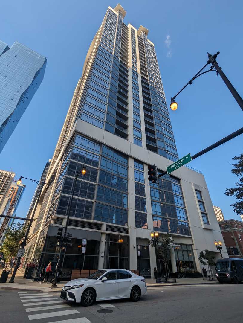 a view of a street with car parked