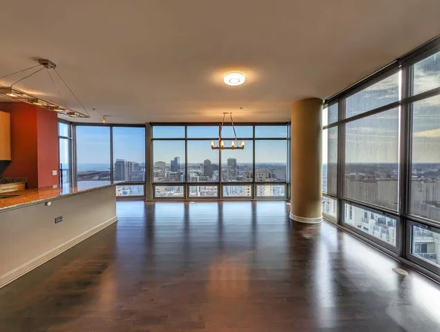 a view of an entryway with wooden floor