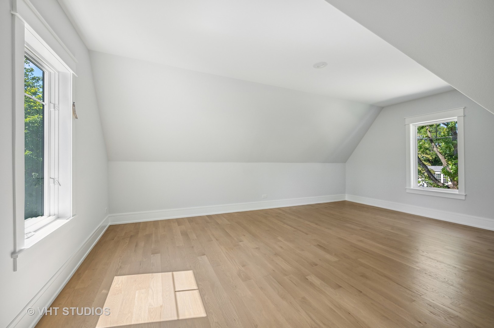 1835 Central Road Glenview, IL 60025 - Photo 16 of 27 an empty room with wooden floor and windows