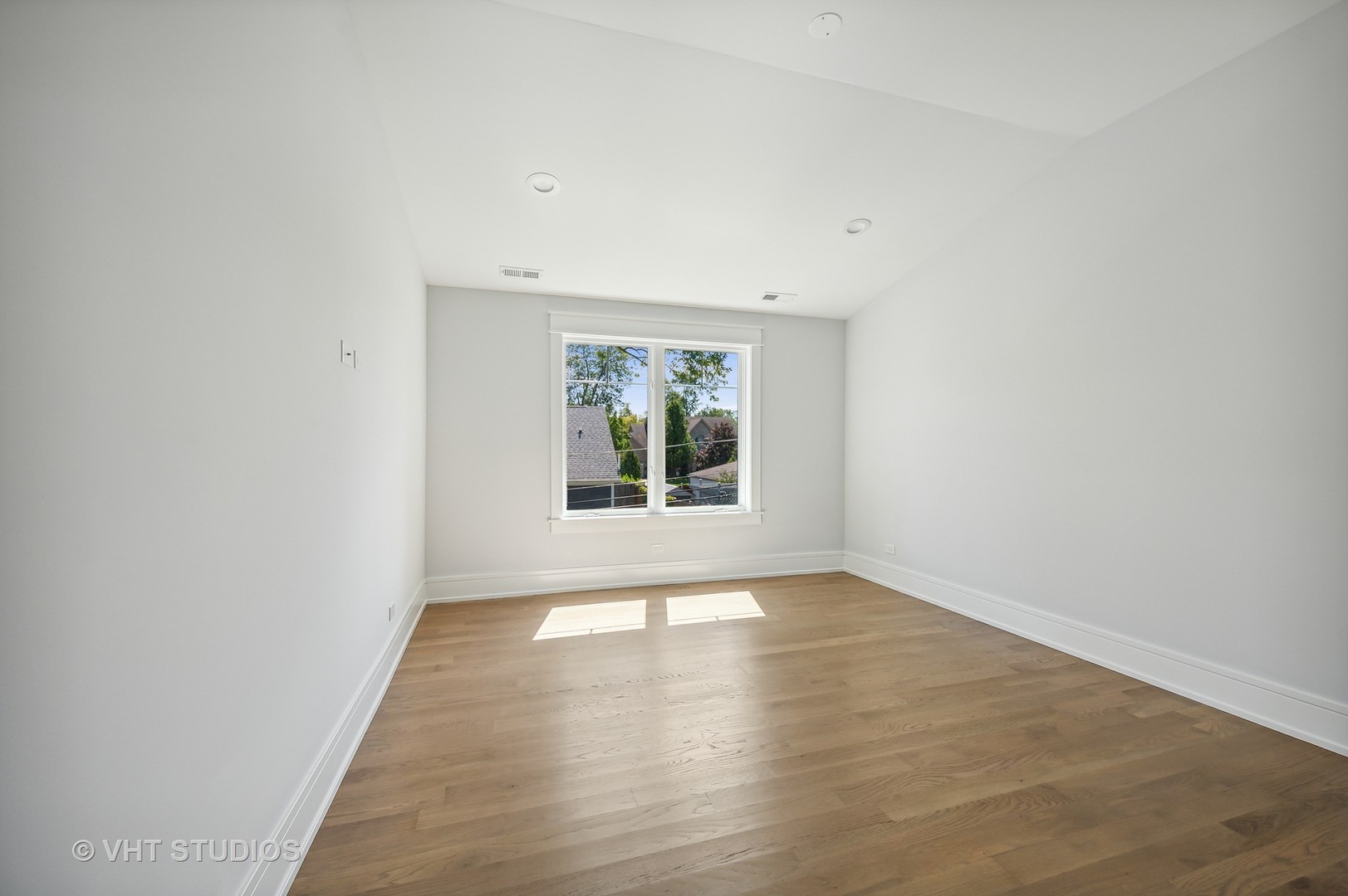 1835 Central Road Glenview, IL 60025 - Photo 20 of 27 a view of an empty room with wooden floor and a window
