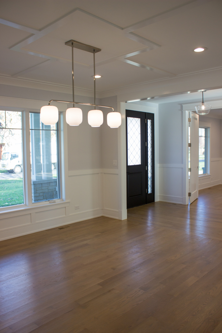 1835 Central Road Glenview, IL 60025 - Photo 6 of 27 an empty room with windows and chandelier