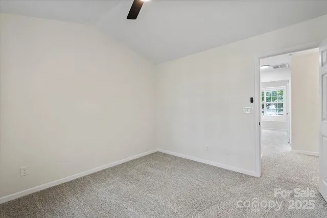 an empty room with fan