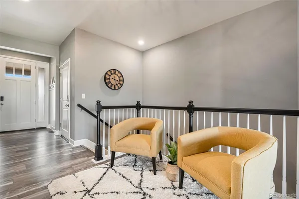 a bedroom with a bed and a table chair