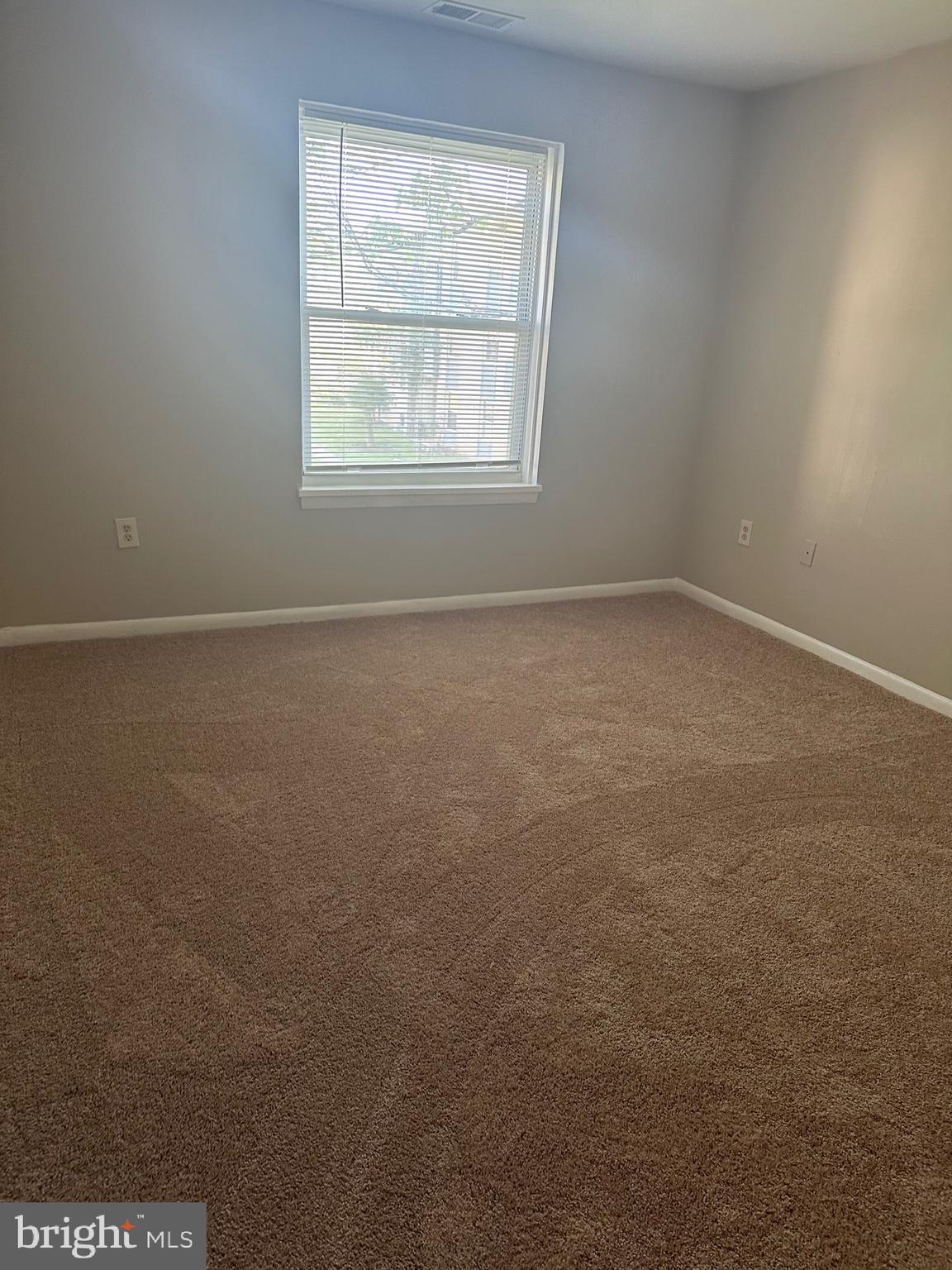 3837 St Barnabas Road, Unit 103 Suitland, MD 20746 - Photo 7 of 10 an empty room with a window