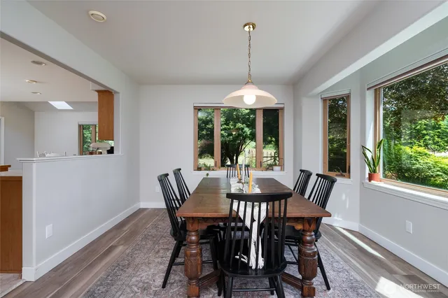 a view of a dining room with furniture window and outside view