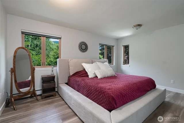 a bed room with a bed and a chair