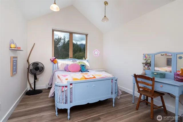 a bedroom with furniture and a window