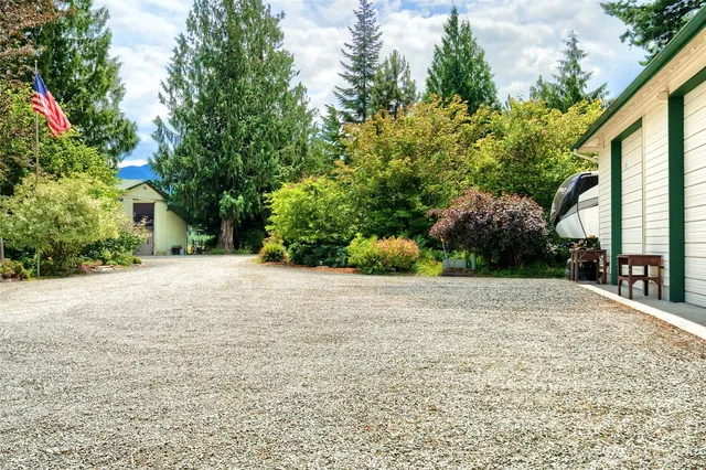 a backyard of a house with outdoor seating