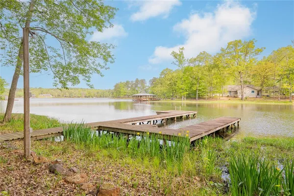 a view of a lake with outdoor seating