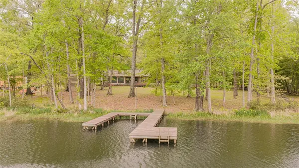 a swimming pool with lawn chairs