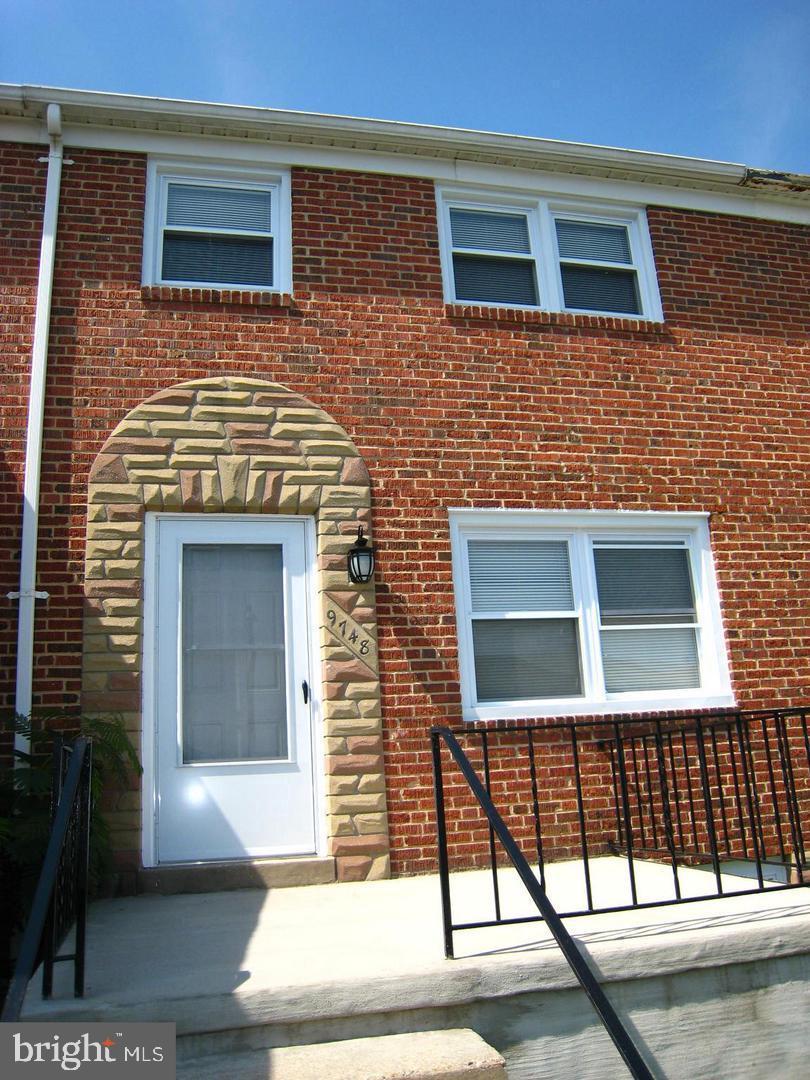 9748 Matzon Road Baltimore, MD 21220 - Photo 2 of 17 Federal Porch front brick townhome (concrete)