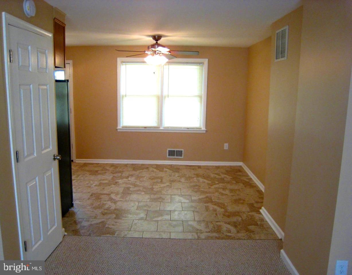 9748 Matzon Road Baltimore, MD 21220 - Photo 5 of 17 Tiled dining area opens to the living room