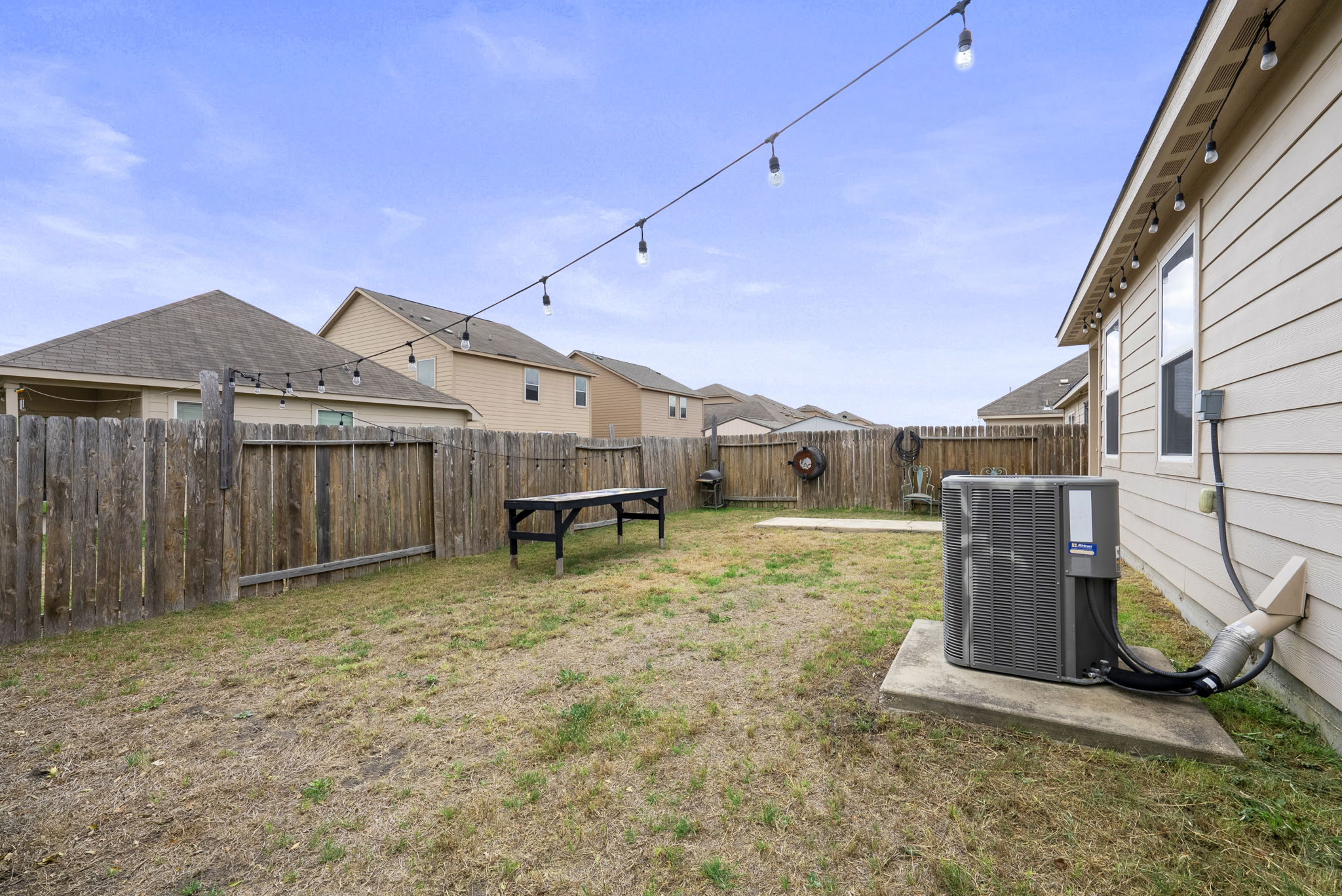 1617 Treeta Trail Kyle, TX 78640 - Photo 35 of 39 Fenced backyard featuring a residential view