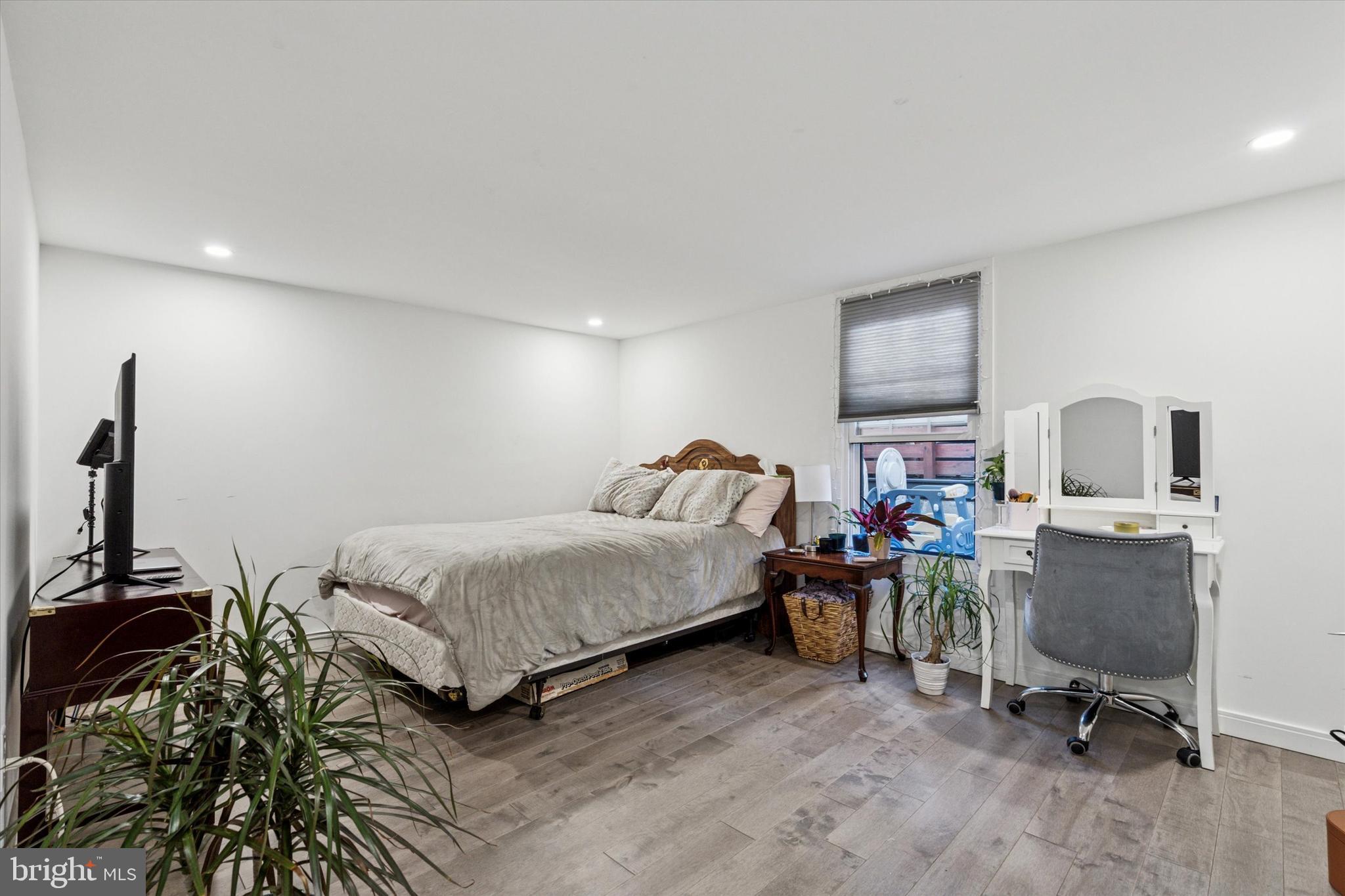 2694 Bridge Street Philadelphia, PA 19137 - Photo 31 of 41 a bedroom with a bed a desk and chair