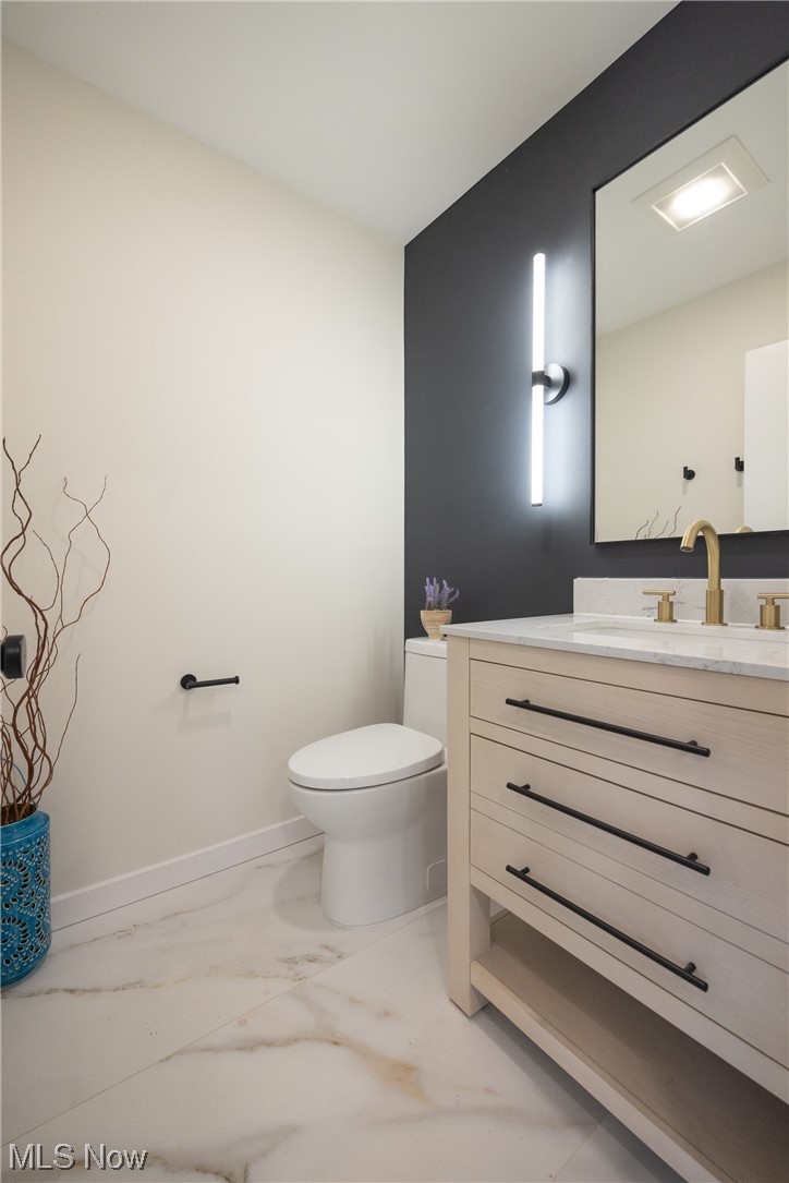 32887 Cedar Road Mayfield Heights, OH 44124 - Photo 11 of 44 Bathroom featuring vanity, toilet, and tile flooring