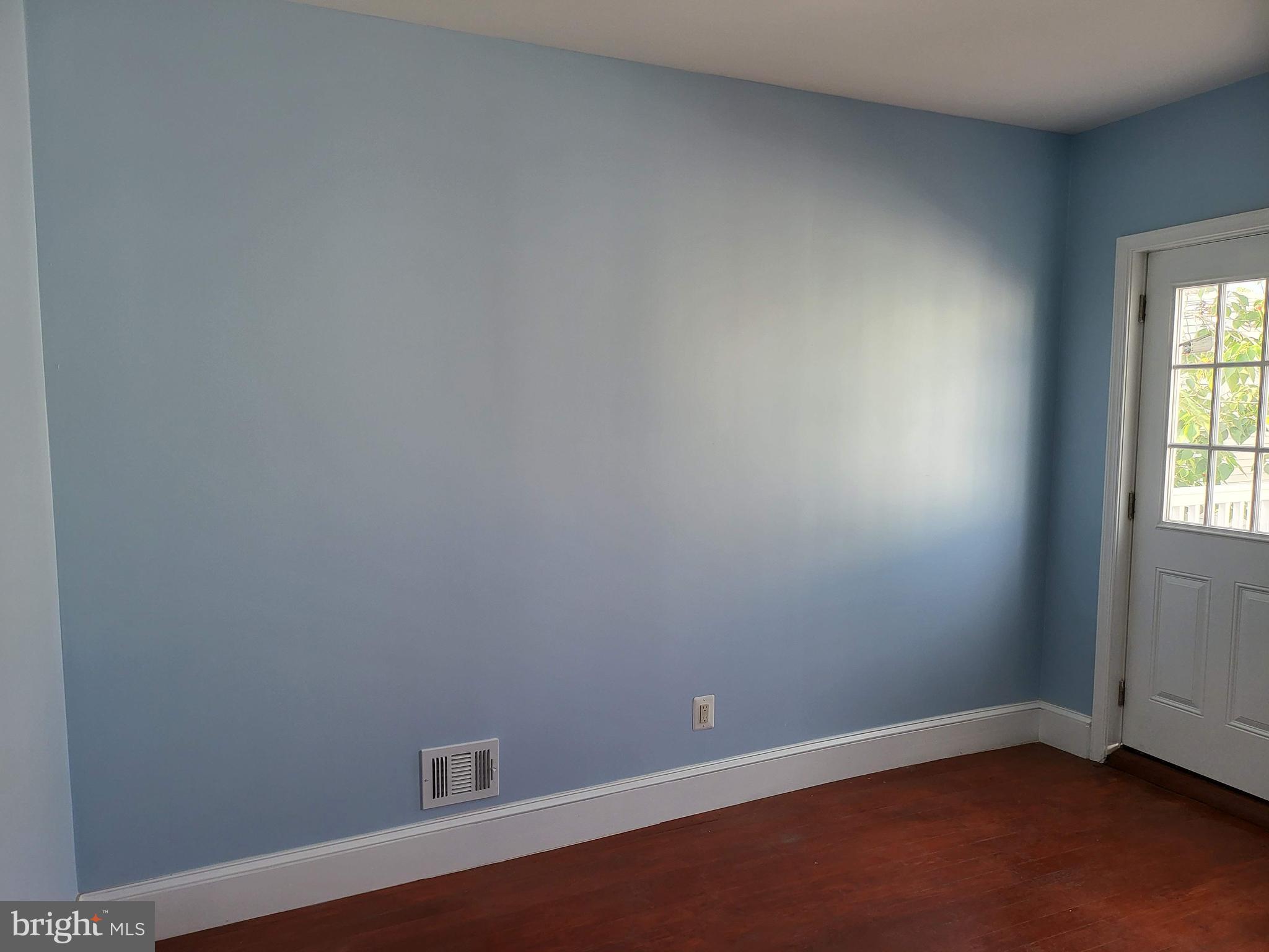 1817 Mifflin Street Philadelphia, PA 19145 - Photo 13 of 16 an empty room with a window