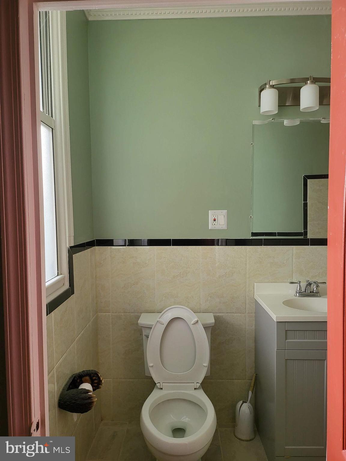 1817 Mifflin Street Philadelphia, PA 19145 - Photo 4 of 16 a bathroom with a toilet and a sink