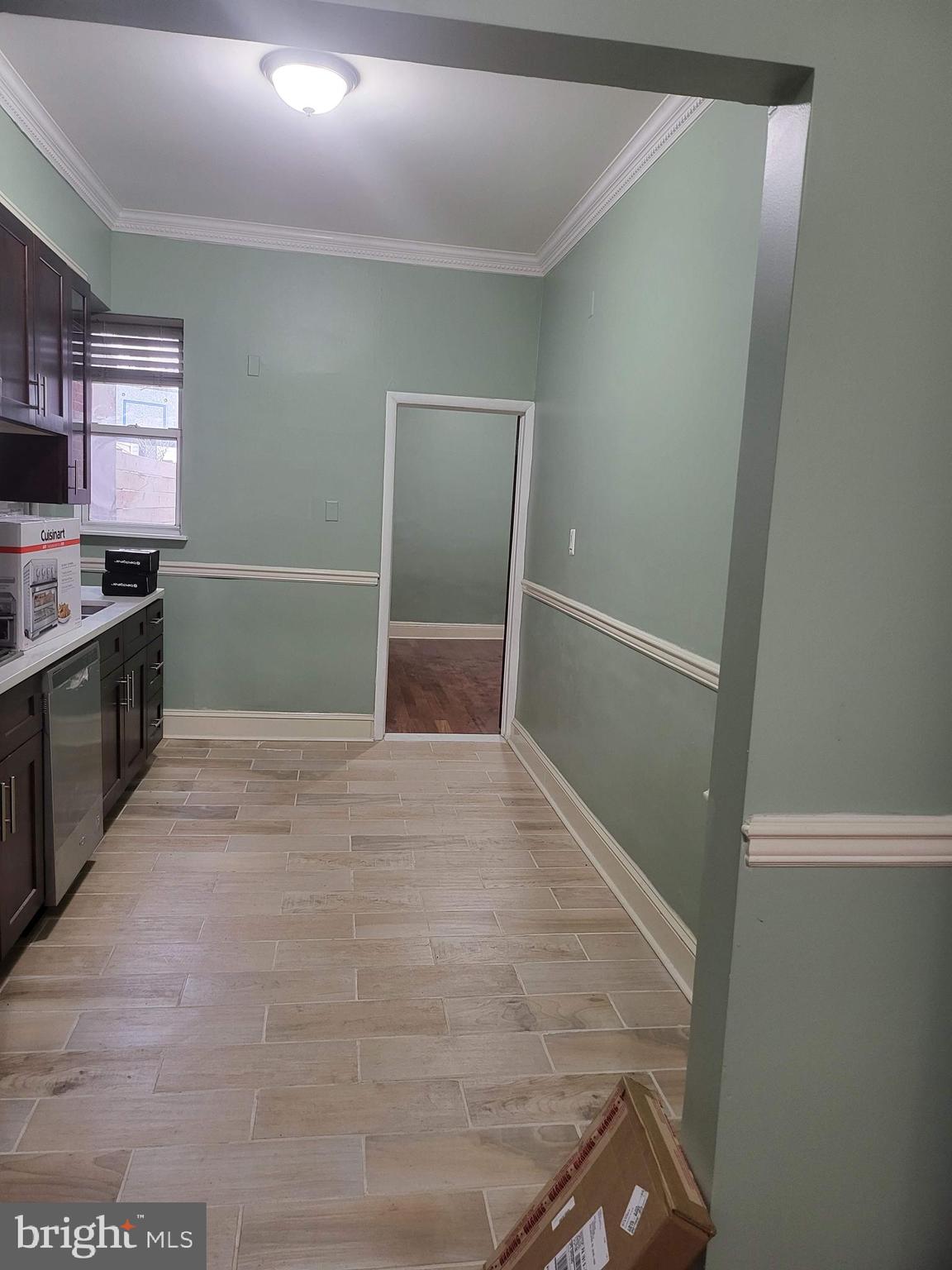 1817 Mifflin Street Philadelphia, PA 19145 - Photo 5 of 16 a view of an empty room with a kitchen