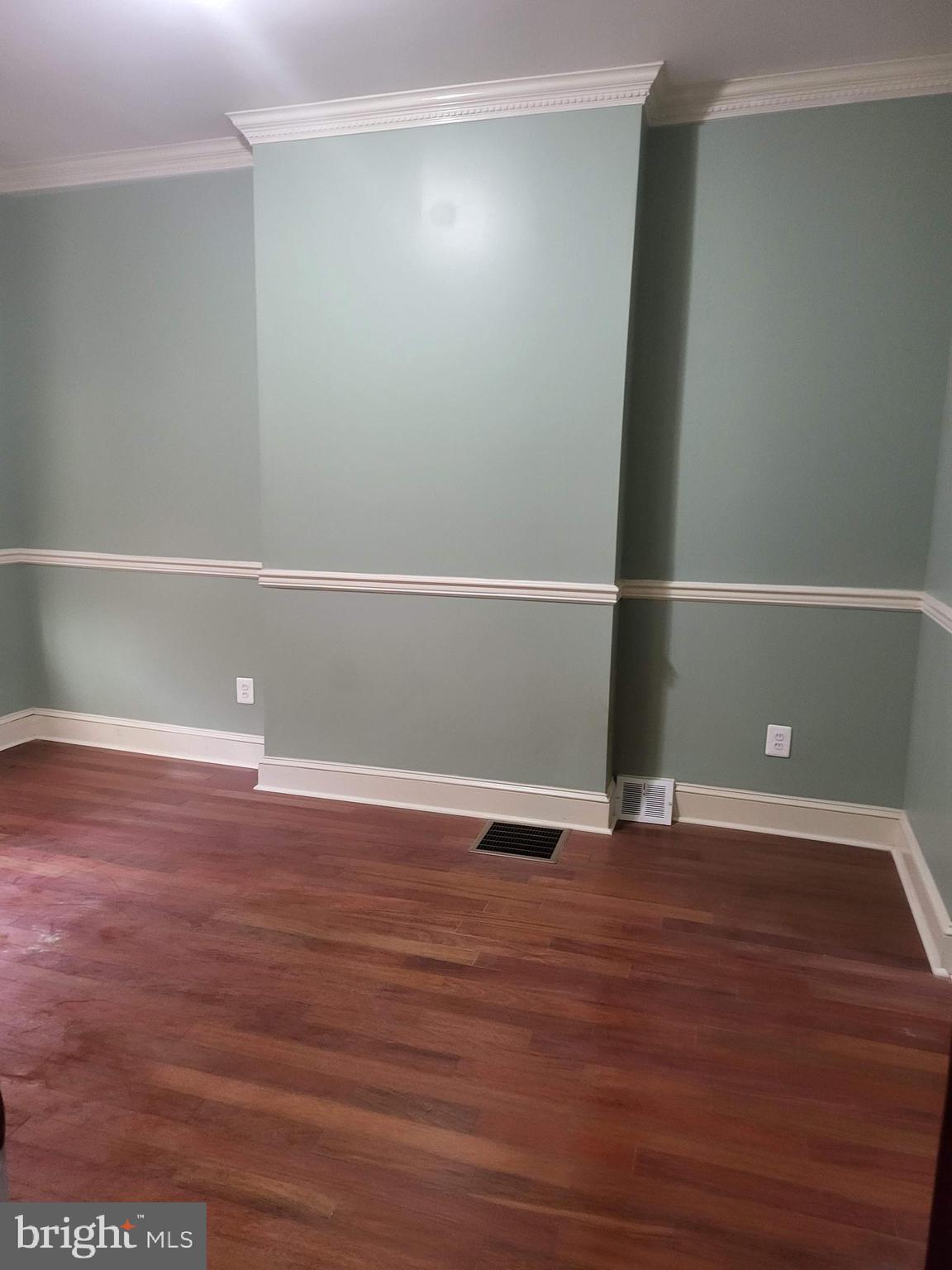 1817 Mifflin Street Philadelphia, PA 19145 - Photo 8 of 16 a view of an empty room with wooden floor