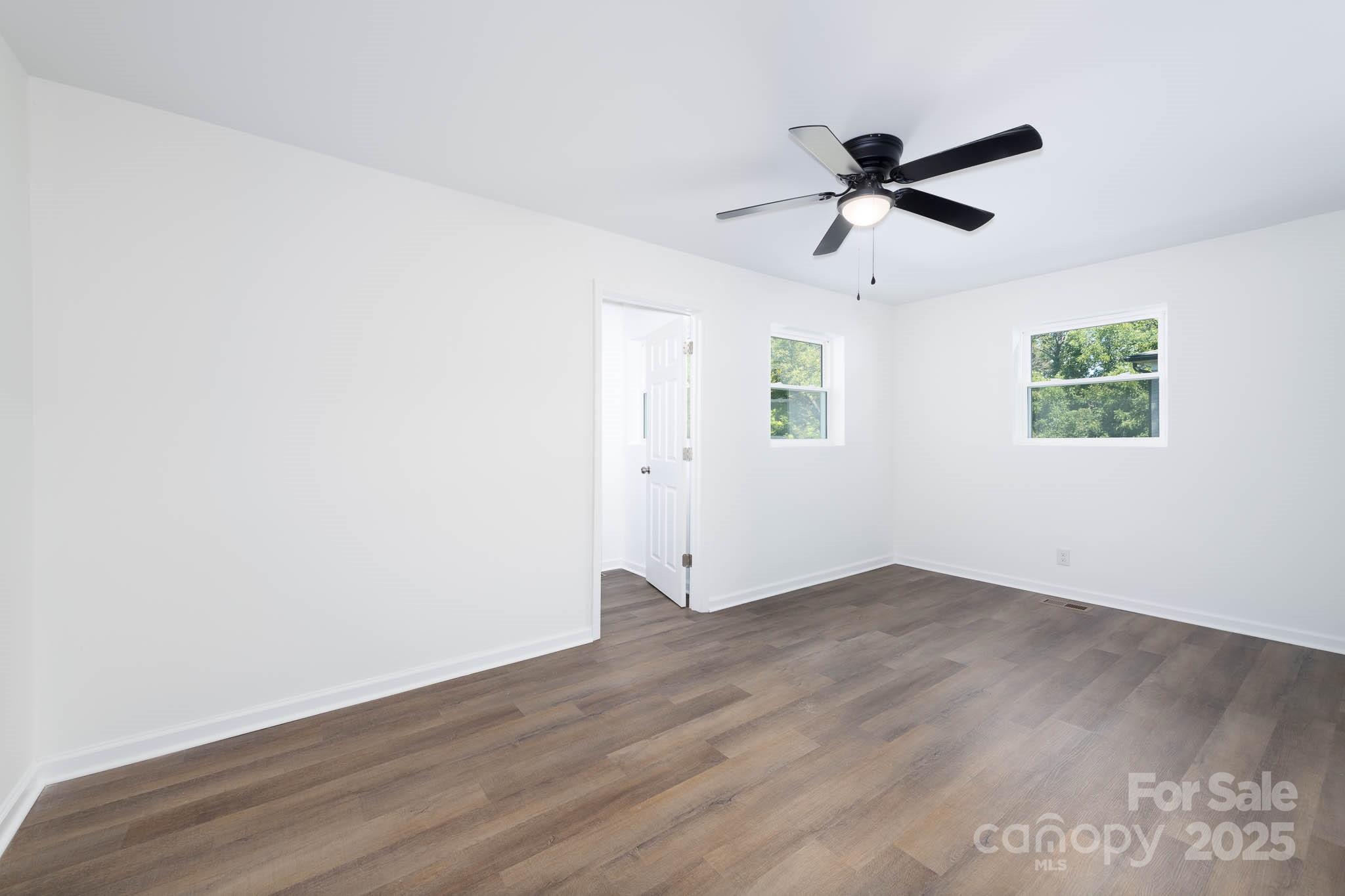 108 South Little Texas Road Kannapolis, NC 28083 - Photo 13 of 24 an empty room with wooden floor closet and windows